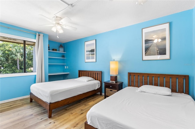 1051 S Highland St Unit 7D, Mount Dora, FL 32757 - bedroom featuring wood finished floors and ceiling fan