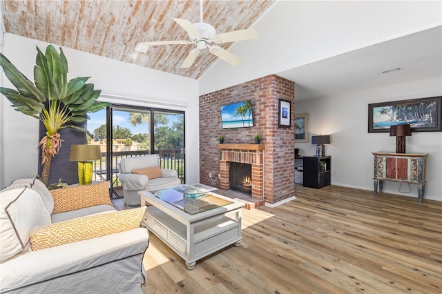 1051 S Highland St Unit 7D, Mount Dora, FL 32757 - living area featuring high vaulted ceiling, light wood-style floors, a brick fireplace, ceiling fan, and wood ceiling