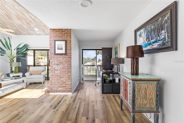 1051 S Highland St Unit 7D, Mount Dora, FL 32757 - hall featuring an office area and wood finished floors