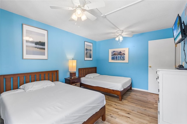 1051 S Highland St Unit 7D, Mount Dora, FL 32757 - bedroom featuring light wood-style flooring and a ceiling fan