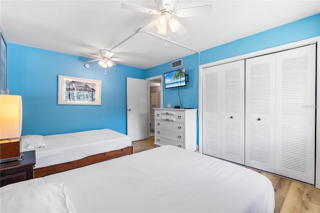 1051 S Highland St Unit 7D, Mount Dora, FL 32757 - bedroom featuring wood finished floors, a closet, and a ceiling fan