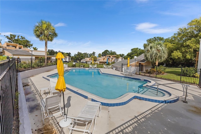 1051 S Highland St Unit 7D, Mount Dora, FL 32757 - community pool featuring a patio and a residential view