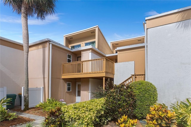 1051 S Highland St Unit 7D, Mount Dora, FL 32757 - rear view of property featuring a balcony and stucco siding