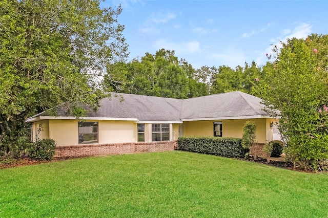 10448 SW 74th Ct, Ocala, FL 34476 - ranch-style home featuring a front yard, stucco siding, and brick siding