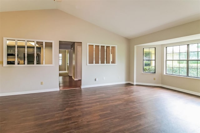 10448 SW 74th Ct, Ocala, FL 34476 - spare room featuring healthy amount of natural light, vaulted ceiling, and dark wood finished floors