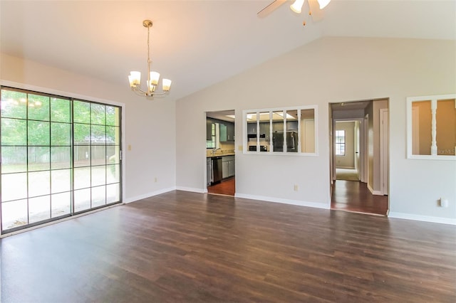 10448 SW 74th Ct, Ocala, FL 34476 - empty room featuring a chandelier, healthy amount of natural light, lofted ceiling, a ceiling fan, and dark wood-style flooring