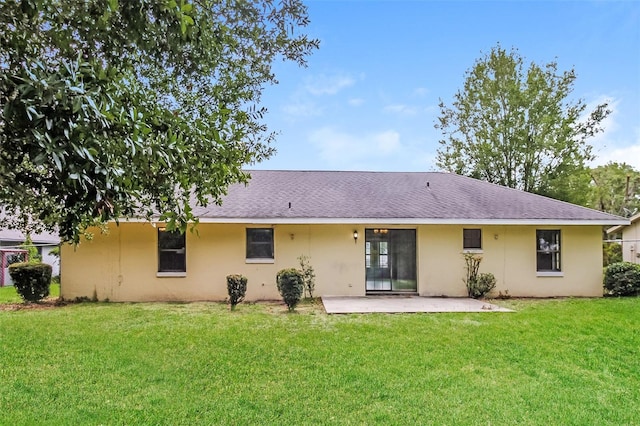 10448 SW 74th Ct, Ocala, FL 34476 - rear view of house featuring a yard, a patio, and stucco siding