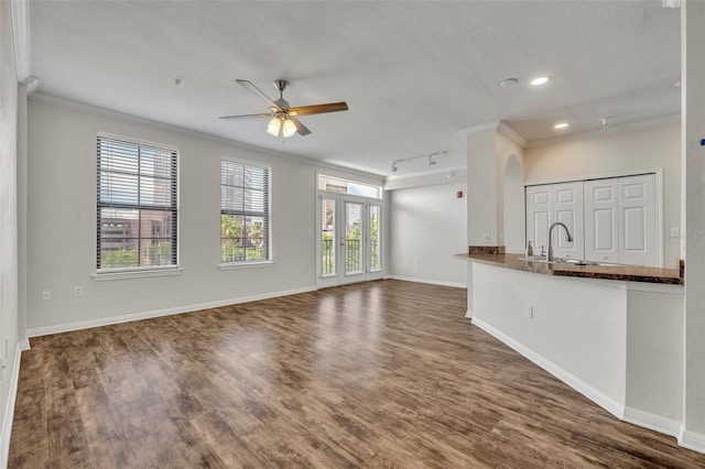 911 N Orange Ave Unit 443, Orlando, FL 32801 - unfurnished living room with ornamental molding, a ceiling fan, wood finished floors, track lighting, and recessed lighting