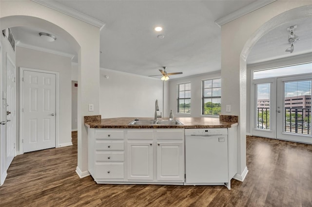 911 N Orange Ave Unit 443, Orlando, FL 32801 - kitchen with white dishwasher, dark countertops, ornamental molding, a ceiling fan, and dark wood-style floors