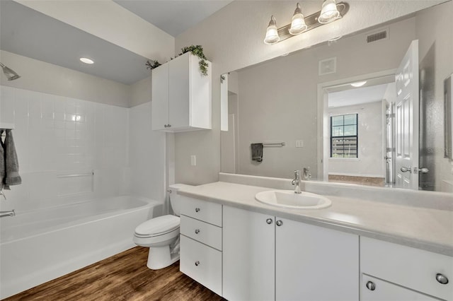 911 N Orange Ave Unit 443, Orlando, FL 32801 - full bath featuring vanity, wood finished floors, and washtub / shower combination