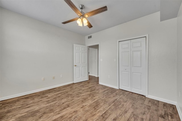 911 N Orange Ave Unit 443, Orlando, FL 32801 - unfurnished bedroom with wood finished floors, a closet, and ceiling fan