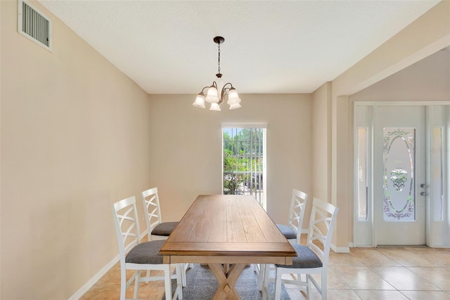 5819 Covington Cove Way, Orlando, FL 32829 - dining area with a chandelier and light tile patterned flooring