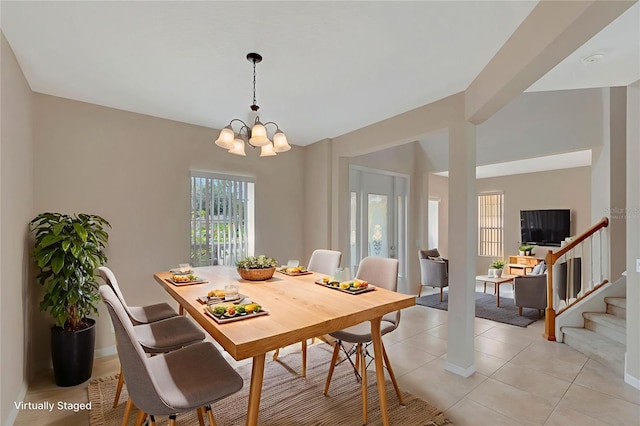 5819 Covington Cove Way, Orlando, FL 32829 - dining room with a chandelier and light tile patterned floors