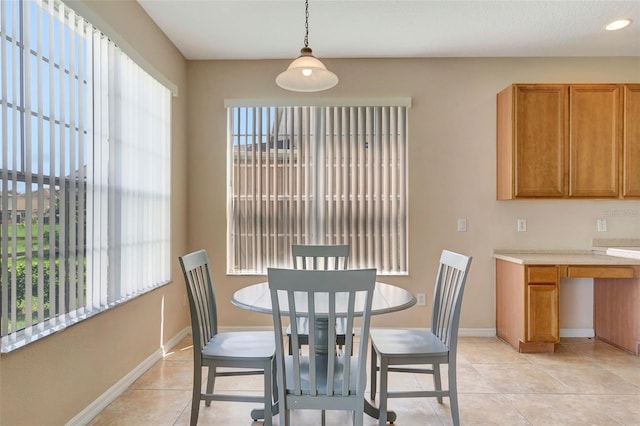 5819 Covington Cove Way, Orlando, FL 32829 - dining room featuring baseboards and light tile patterned flooring