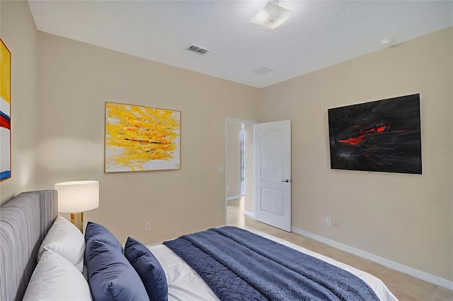 5819 Covington Cove Way, Orlando, FL 32829 - bedroom with light tile patterned floors and baseboards