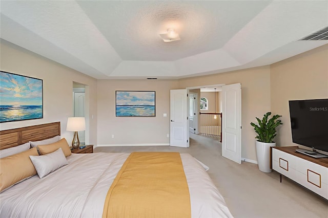 5819 Covington Cove Way, Orlando, FL 32829 - bedroom featuring a tray ceiling and light carpet