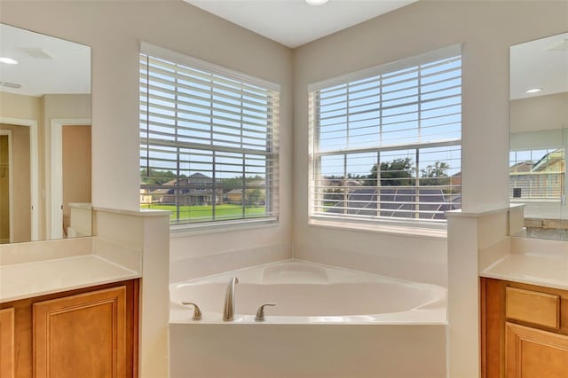 5819 Covington Cove Way, Orlando, FL 32829 - full bath with plenty of natural light, vanity, and a bath
