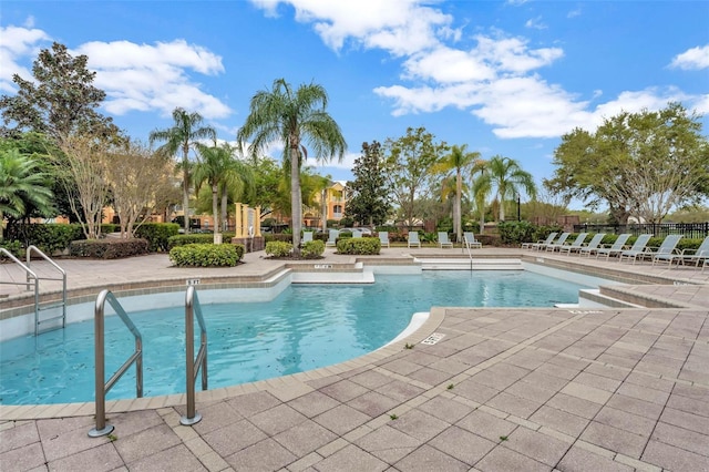 5819 Covington Cove Way, Orlando, FL 32829 - community pool featuring a patio area