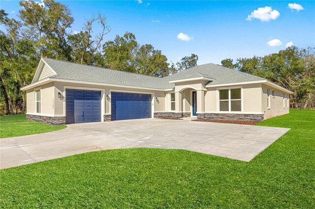 12258 SW 76th Ln, Dunnellon, FL 34432 - ranch-style home with stone siding, stucco siding, a garage, and concrete driveway