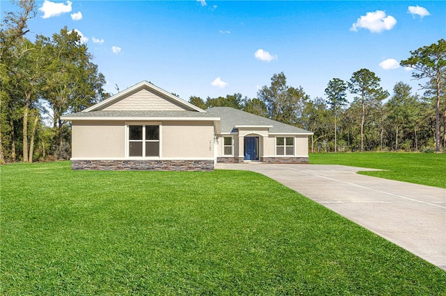 12258 SW 76th Ln, Dunnellon, FL 34432 - ranch-style house with stucco siding, stone siding, and a front lawn
