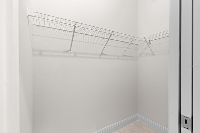 12258 SW 76th Ln, Dunnellon, FL 34432 - walk in closet with light tile patterned flooring