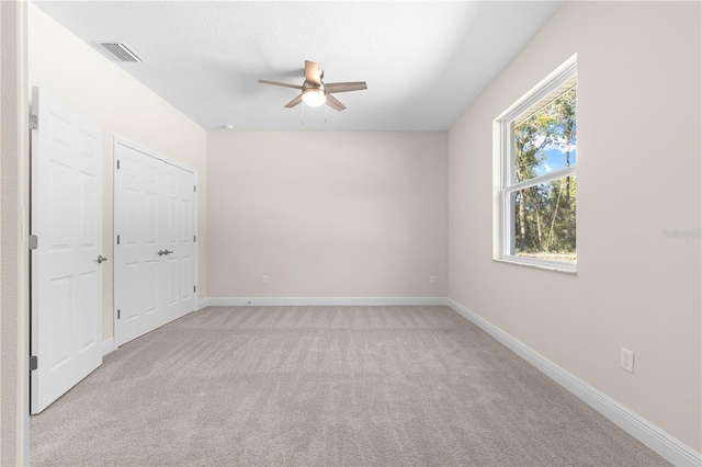 12258 SW 76th Ln, Dunnellon, FL 34432 - unfurnished bedroom with light carpet and a ceiling fan