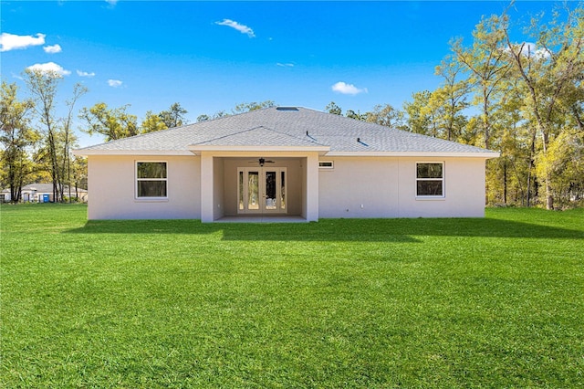 12258 SW 76th Ln, Dunnellon, FL 34432 - rear view of property featuring ceiling fan, stucco siding, french doors, and a yard