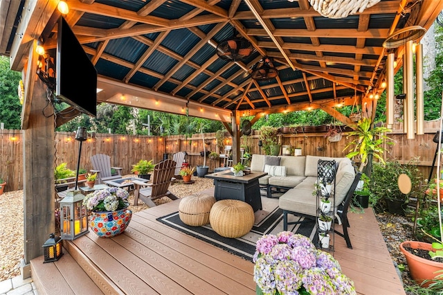 808 Camphor Way, Melbourne, FL 32901 - wooden deck featuring an outdoor living space with a fire pit, a fenced backyard, and a gazebo