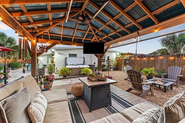 808 Camphor Way, Melbourne, FL 32901 - fenced backyard with a hot tub, a gazebo, an outdoor living space with a fire pit, and a patio