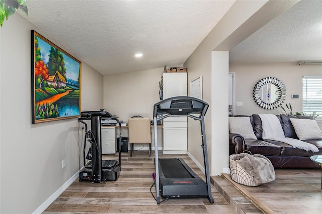 808 Camphor Way, Melbourne, FL 32901 - exercise area featuring a textured ceiling, light wood-style floors, and recessed lighting