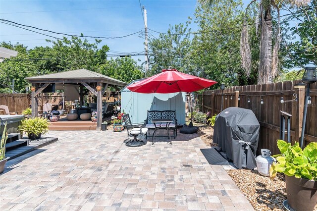 808 Camphor Way, Melbourne, FL 32901 - fenced backyard featuring a gazebo, a grill, and a patio area