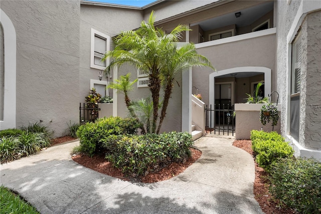 308 N Shadowbay Blvd Unit 214, Longwood, FL 32779 - property entrance with stucco siding and a gate