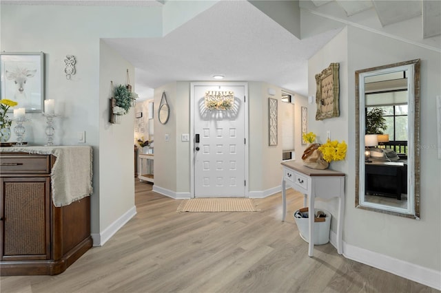 308 N Shadowbay Blvd Unit 214, Longwood, FL 32779 - entrance foyer featuring light wood finished floors and baseboards