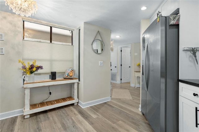 308 N Shadowbay Blvd Unit 214, Longwood, FL 32779 - hallway featuring light wood-style floors, a chandelier, and recessed lighting
