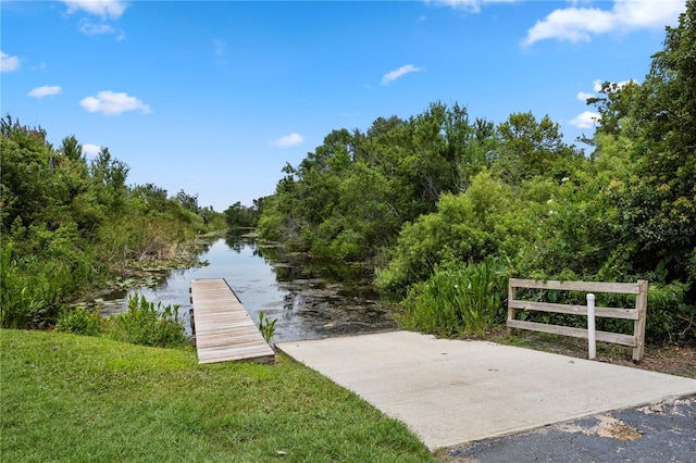 308 N Shadowbay Blvd Unit 214, Longwood, FL 32779 - dock featuring a boat ramp, a water view, and a forest view
