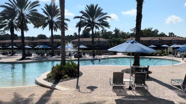 2717 Camaro Dr, Kissimmee, FL 34746 - community pool featuring a patio and a residential view
