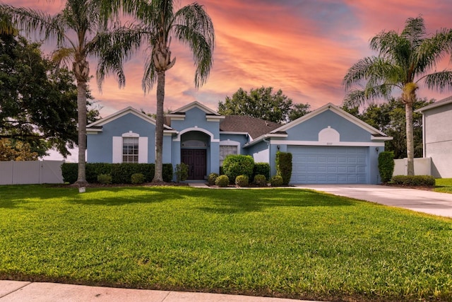 2237 Wintermere Pointe Dr, Winter Garden, FL 34787 - view of front of property with stucco siding, a garage, and driveway