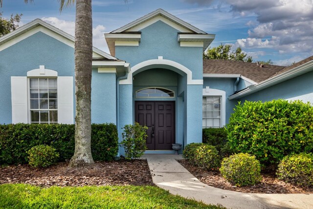 2237 Wintermere Pointe Dr, Winter Garden, FL 34787 - view of exterior entry with stucco siding