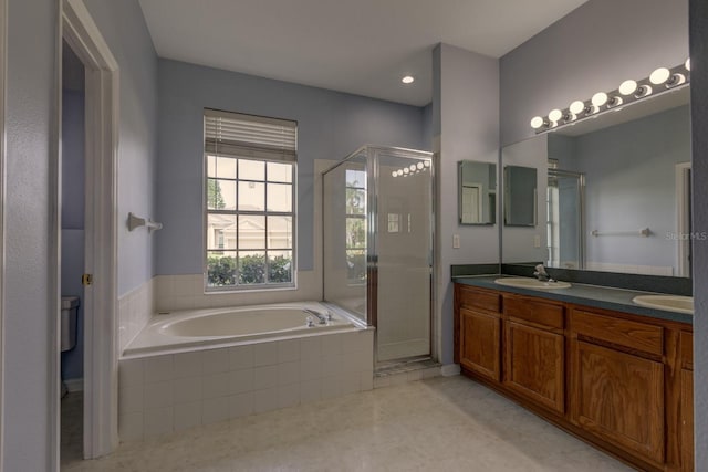2237 Wintermere Pointe Dr, Winter Garden, FL 34787 - full bath featuring a bath, a stall shower, double vanity, and tile patterned flooring
