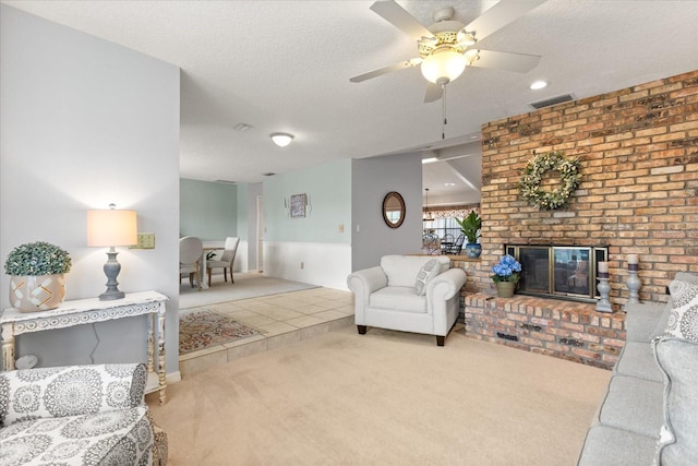 548 Timber Ridge Dr, Longwood, FL 32779 - living room with carpet floors, ceiling fan, a brick fireplace, a textured ceiling, and recessed lighting