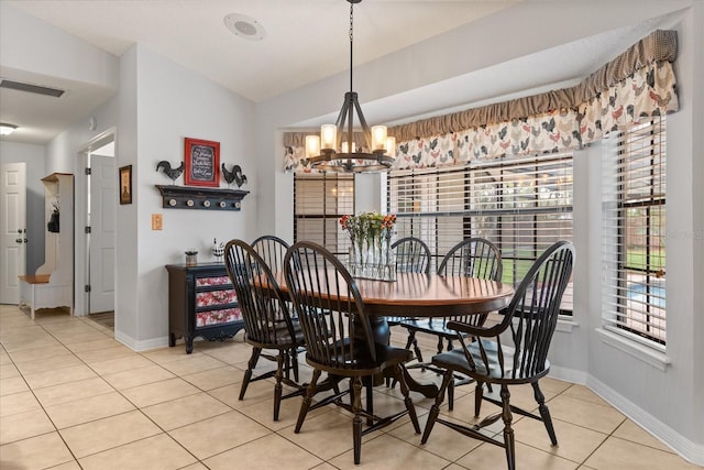 548 Timber Ridge Dr, Longwood, FL 32779 - dining space with light tile patterned floors, a chandelier, and vaulted ceiling