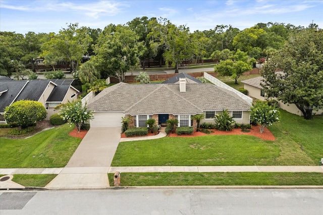 548 Timber Ridge Dr, Longwood, FL 32779 - view of front of house with concrete driveway, a garage, and a front lawn