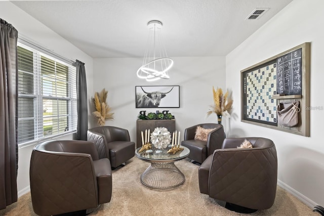 2355 White Lilly Dr, Kissimmee, FL 34747 - living area featuring a chandelier and carpet