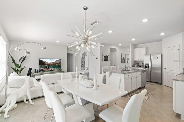 2355 White Lilly Dr, Kissimmee, FL 34747 - dining space featuring a chandelier and recessed lighting