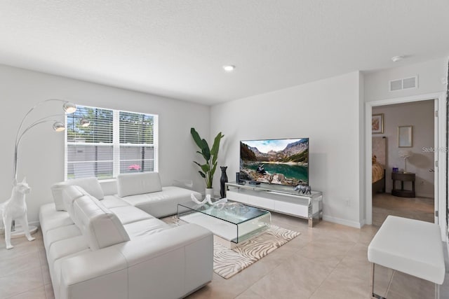 2355 White Lilly Dr, Kissimmee, FL 34747 - living room featuring light tile patterned floors and recessed lighting