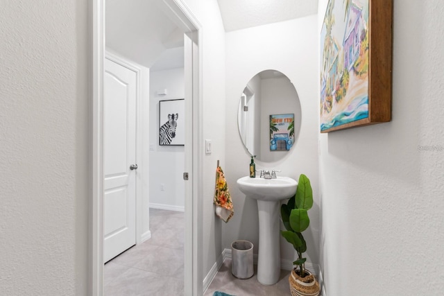 2355 White Lilly Dr, Kissimmee, FL 34747 - bathroom with tile patterned flooring and baseboards