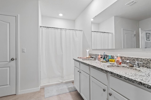 2355 White Lilly Dr, Kissimmee, FL 34747 - bathroom with double vanity, a shower with curtain, and tile patterned flooring