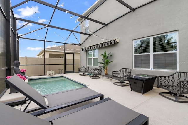 2355 White Lilly Dr, Kissimmee, FL 34747 - view of pool featuring a patio area, glass enclosure, and an outdoor living space