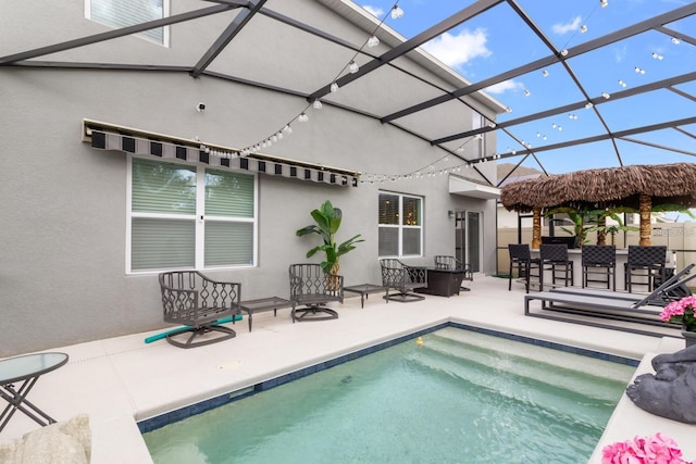 2355 White Lilly Dr, Kissimmee, FL 34747 - swimming pool with a patio area and glass enclosure