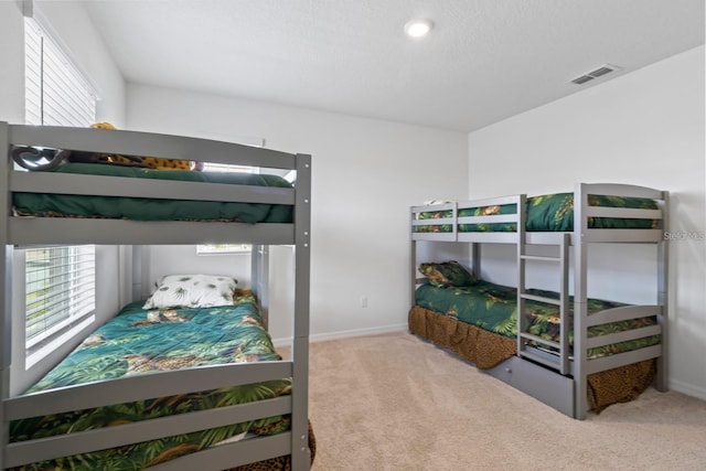 2355 White Lilly Dr, Kissimmee, FL 34747 - carpeted bedroom with multiple windows